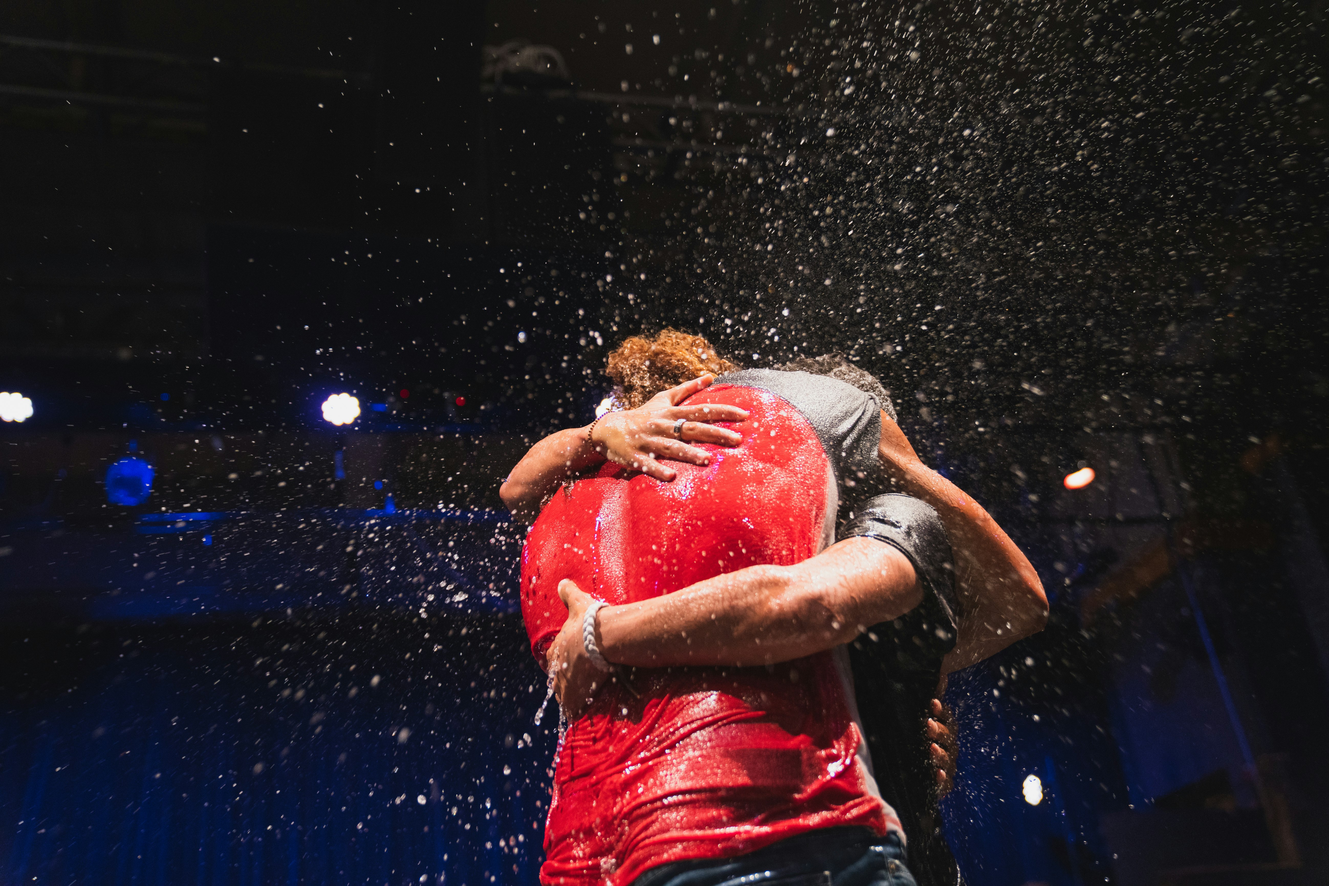 two people standing and hugging